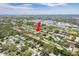 Community aerial view highlighting well-maintained grounds, trees, and nearby amenities at 1701 Pinehurst Rd # 27D, Dunedin, FL 34698