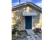 Back entrance with dark blue door and white awning above the entrance at 2301 46Th S St, St Petersburg, FL 33711