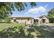 Backyard view of the home showcasing an expansive lawn, perfect for outdoor activities and entertaining at 2301 46Th S St, St Petersburg, FL 33711