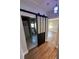 Hallway view of a bathroom, featuring a sliding barn door and mosaic tile floor at 2301 46Th S St, St Petersburg, FL 33711