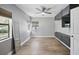 Minimalist bedroom with natural light, light gray walls, and dark built in storage along the wall at 2301 46Th S St, St Petersburg, FL 33711