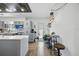 Modern kitchen features gray cabinets, white countertops, stainless steel appliances, and a rustic wood ceiling accent at 2301 46Th S St, St Petersburg, FL 33711