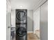 Compact laundry room with modern stacked washer and dryer unit, maximizing space and efficiency at 2301 46Th S St, St Petersburg, FL 33711