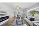 Inviting living room with a modern fireplace, wood flooring, and neutral decor, creating a relaxing atmosphere at 2301 46Th S St, St Petersburg, FL 33711