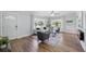 Cozy living room with large windows providing natural light, comfortable seating, and wood flooring at 2301 46Th S St, St Petersburg, FL 33711