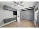 Spacious bedroom with wood floors, storage, dark accents, a ceiling fan, and ample natural light at 2301 46Th S St, St Petersburg, FL 33711