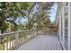 Wood deck with leafy tree views and an adjacent walkway at 2967 Bayshore Pointe Dr, Tampa, FL 33611