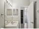 Bathroom with vanity and stacked washer/dryer, offering convenience and functionality in a compact space at 2967 Bayshore Pointe Dr, Tampa, FL 33611