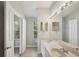 Bright bathroom featuring a double sink vanity with neutral countertops and large mirrors, offering ample space and natural light at 2967 Bayshore Pointe Dr, Tampa, FL 33611