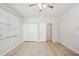 Spacious bedroom with tile flooring, featuring a double closet and an ensuite bathroom, providing ample storage and convenience at 2967 Bayshore Pointe Dr, Tampa, FL 33611