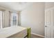 Well-lit bedroom with a minimalist bed frame, large window, and neutral walls, creating a calm and inviting space at 2967 Bayshore Pointe Dr, Tampa, FL 33611