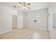 Bright bedroom features tile flooring, ceiling fan, and a large window at 2967 Bayshore Pointe Dr, Tampa, FL 33611