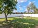 Expansive backyard with a mature tree, a concrete slab, and green grass at 3411 W Paris St, Tampa, FL 33614