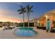 Waterfront backyard with a spacious pool, lounge chairs, and beautiful landscaping at 3943 Fontainebleau Dr, Tampa, FL 33634