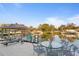 Patio with seating, waterfront views, a covered boat dock, and a dining area at 3943 Fontainebleau Dr, Tampa, FL 33634