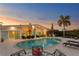 Backyard oasis with a large private pool, patio furniture, and a tiki bar, perfect for outdoor entertaining at 3943 Fontainebleau Dr, Tampa, FL 33634