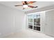Bedroom with white walls and sliding doors to access to backyard and swimming pool at 3943 Fontainebleau Dr, Tampa, FL 33634