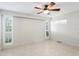 Bedroom with neutral colors and a ceiling fan with decorative lighting at 3943 Fontainebleau Dr, Tampa, FL 33634