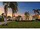 Charming home with lush landscaping, a well-manicured lawn, and a brick driveway at 3943 Fontainebleau Dr, Tampa, FL 33634
