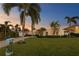 Charming home with a well-manicured lawn, palm trees, and a brick driveway at 3943 Fontainebleau Dr, Tampa, FL 33634
