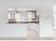 This kitchen features white cabinetry, granite countertops, and stainless steel appliances at 3943 Fontainebleau Dr, Tampa, FL 33634