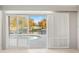 A bright living room with sliding doors opening to the waterfront pool at 3943 Fontainebleau Dr, Tampa, FL 33634