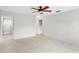 Spacious main bedroom with tile flooring, ceiling fan, and an ensuite bathroom at 3943 Fontainebleau Dr, Tampa, FL 33634