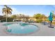 Travertine patio with a pool, covered boat dock, and waterfront seating and dining areas at 3943 Fontainebleau Dr, Tampa, FL 33634