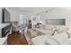 Bright and airy living room with ample seating and electric fireplace at 4008 Passport Ln # 104, New Port Richey, FL 34653