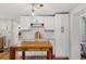 Bright kitchen with white cabinets, subway tile, and butcher block island at 5046 Rosewood Dr, New Port Richey, FL 34653