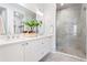 Modern bathroom boasts a double vanity, glass shower, and elegant fixtures for a luxurious feel at 532 W Plaza Pl # 2, Tampa, FL 33602