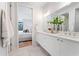 Elegant bathroom with double sink vanity, modern fixtures, and access to the Primary bedroom at 532 W Plaza Pl # 2, Tampa, FL 33602