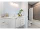 Stylish bathroom with a white vanity, modern decor, and access to a bathtub and shower combination at 532 W Plaza Pl # 2, Tampa, FL 33602