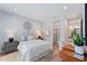 Well-lit bedroom with contemporary decor, desk, and closet for a comfortable and functional living space at 532 W Plaza Pl # 2, Tampa, FL 33602