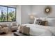 Bright bedroom features large windows, hardwood floors, stylish decor, and comfortable seating for a modern, relaxing retreat at 532 W Plaza Pl # 2, Tampa, FL 33602