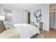 Bright bedroom featuring a large window, modern decor, and an ensuite bathroom for added privacy and comfort at 532 W Plaza Pl # 2, Tampa, FL 33602