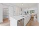 Open kitchen design with a large island, modern appliances, and a pantry closet at 532 W Plaza Pl # 2, Tampa, FL 33602