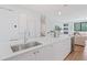 Kitchen island with a stainless steel sink, white countertops, and modern decor at 532 W Plaza Pl # 2, Tampa, FL 33602