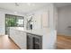 Sleek kitchen island featuring a wine cooler, modern lighting, and ample counter space at 532 W Plaza Pl # 2, Tampa, FL 33602