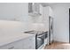 Modern kitchen with white cabinets, stainless steel appliances, and subway tile backsplash at 532 W Plaza Pl # 2, Tampa, FL 33602