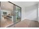 Outdoor patio with wooden decking and an open view into the modern kitchen and living area at 532 W Plaza Pl # 2, Tampa, FL 33602