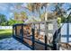 Large chicken coop on paver foundation with secure wire enclosure and covered nesting box at 7115 Edenwood Pl, Tampa, FL 33615