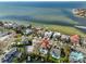 An aerial view of the home's waterfront lot, canal access, and private backyard swimming pool at 912 Symphony Beach Ln, Apollo Beach, FL 33572
