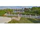 Beautiful backyard with a white picket fence, leading to a private dock at 912 Symphony Beach Ln, Apollo Beach, FL 33572