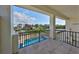 Waterfront balcony view of the pool and canal at 912 Symphony Beach Ln, Apollo Beach, FL 33572