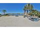 Private beach access for residents, featuring picnic tables and lounge seating at 912 Symphony Beach Ln, Apollo Beach, FL 33572