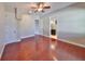 This bedroom features hardwood floors, neutral walls, and a ceiling fan at 912 Symphony Beach Ln, Apollo Beach, FL 33572