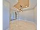 Bright dining room features stone floors, tray ceiling and decorative lighting at 912 Symphony Beach Ln, Apollo Beach, FL 33572
