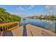 Wooden dock providing waterfront access to the canal at 912 Symphony Beach Ln, Apollo Beach, FL 33572