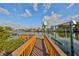 Waterfront property featuring a private dock with boat lift and stunning water views of the harbor and neighborhood at 912 Symphony Beach Ln, Apollo Beach, FL 33572